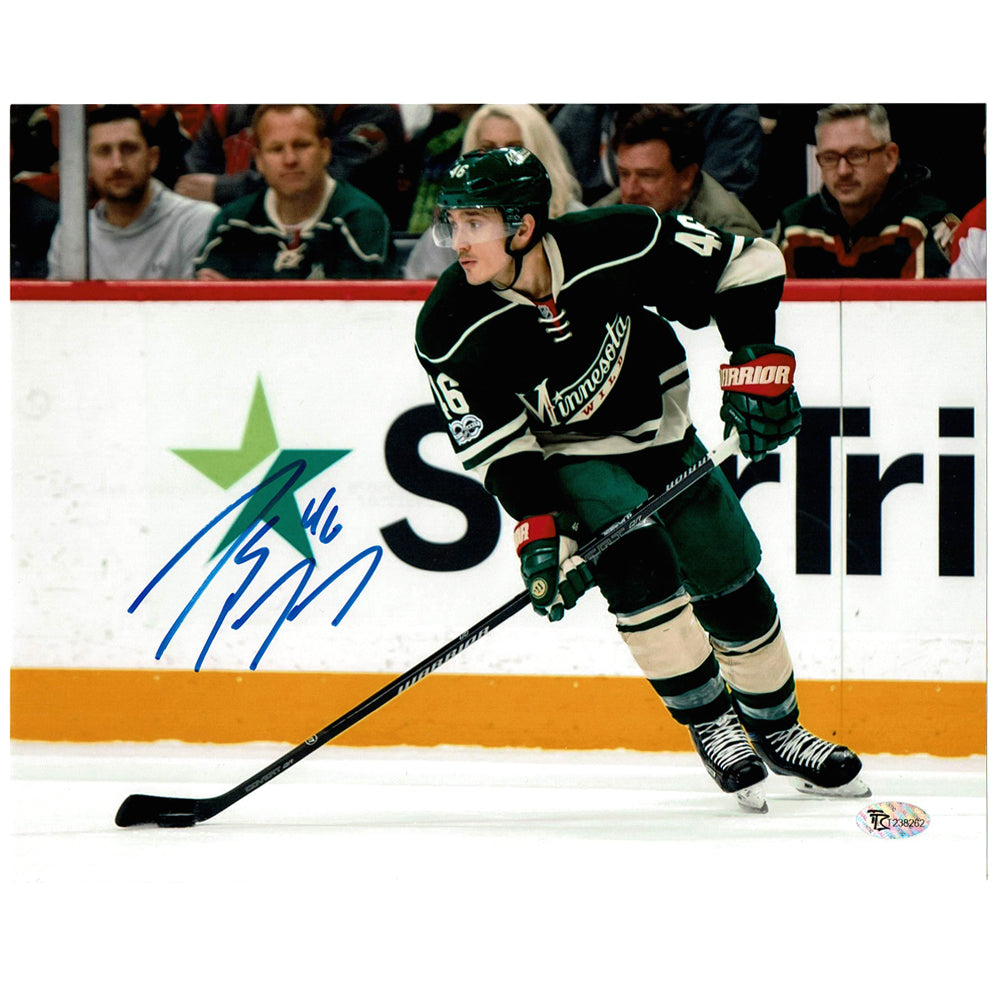 Jared Spurgeon Minnesota Wild Unsigned White Jersey Skating with Puck vs. Los Angeles Kings Photograph